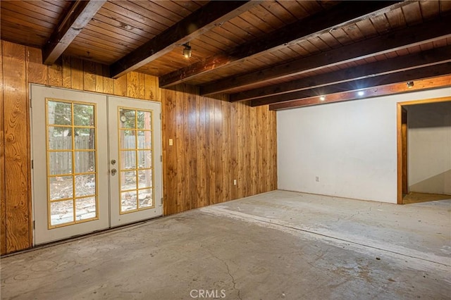 basement featuring wooden walls, french doors, and wooden ceiling