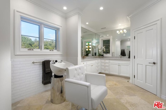 bathroom with vanity, a bathtub, and ornamental molding