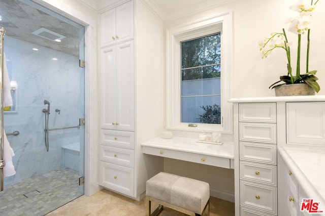 bathroom featuring tile patterned floors, crown molding, and an enclosed shower