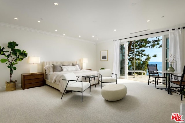 carpeted bedroom featuring access to exterior, a water view, and ornamental molding