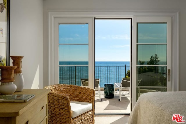 bedroom featuring a water view