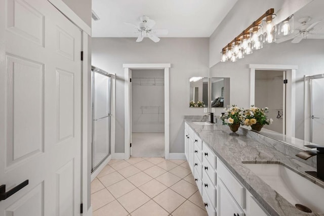 bathroom featuring tile patterned floors, vanity, ceiling fan, and walk in shower