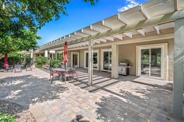 view of patio featuring a pergola and area for grilling