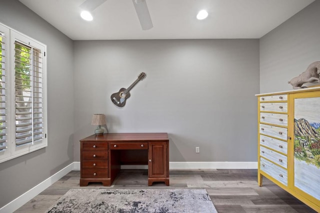 unfurnished office featuring ceiling fan and light hardwood / wood-style floors