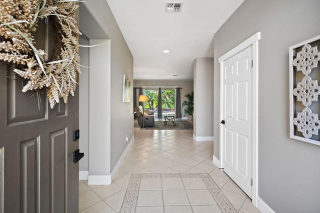 foyer featuring light tile patterned floors