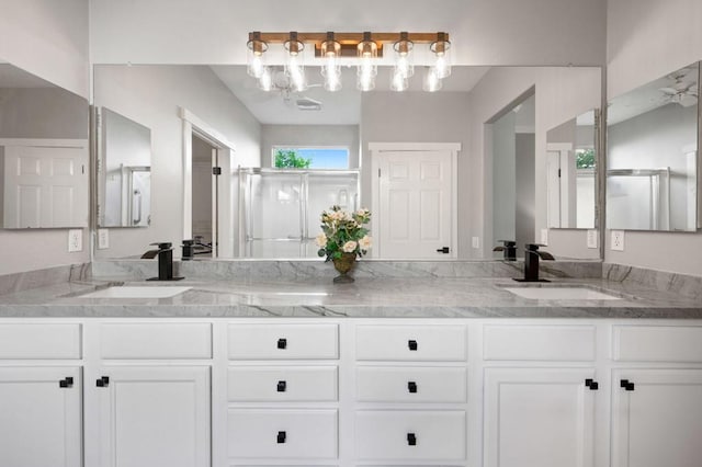 bathroom featuring vanity and walk in shower