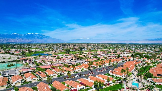 bird's eye view with a water and mountain view