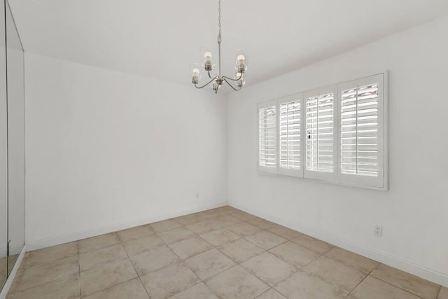 empty room with a chandelier