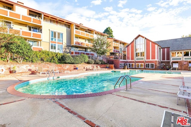 view of pool featuring a patio