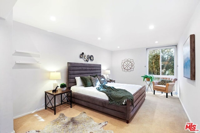 bedroom with light colored carpet