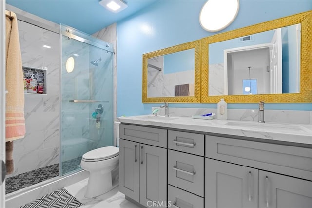 bathroom with vanity, an enclosed shower, and toilet