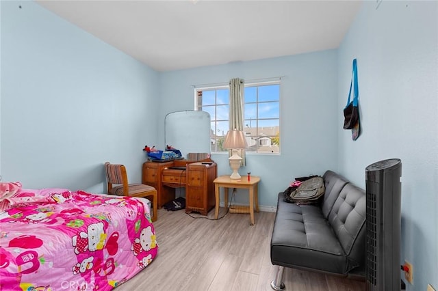 bedroom with light hardwood / wood-style floors