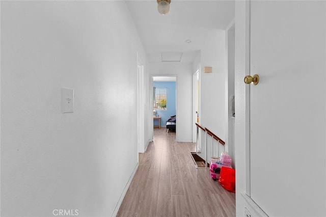 hall with light hardwood / wood-style flooring