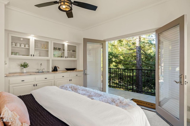 bedroom featuring access to exterior, light carpet, ceiling fan, crown molding, and sink