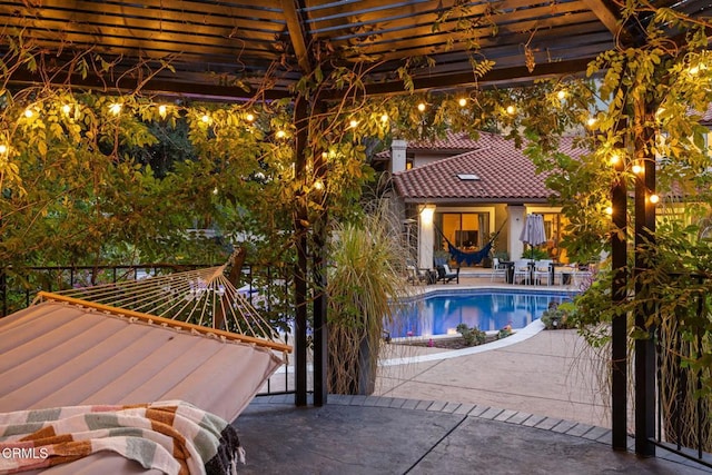 view of swimming pool with a patio