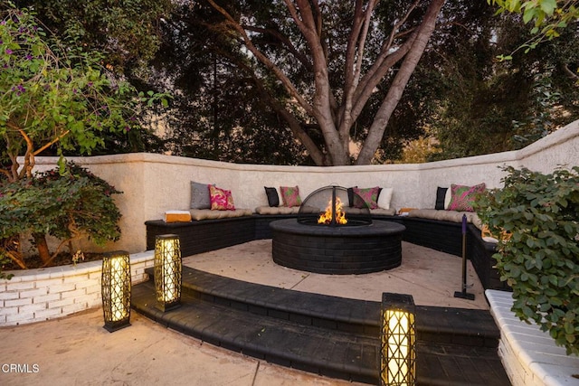 view of patio / terrace with a fire pit