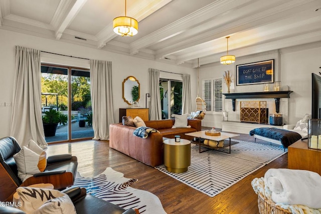 living room with beam ceiling, crown molding, and hardwood / wood-style flooring