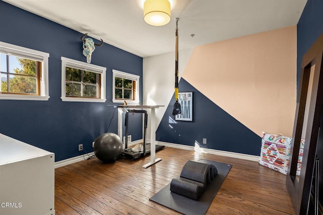 workout area with hardwood / wood-style flooring