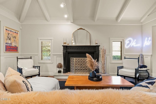 living room featuring beamed ceiling, hardwood / wood-style floors, crown molding, and a healthy amount of sunlight