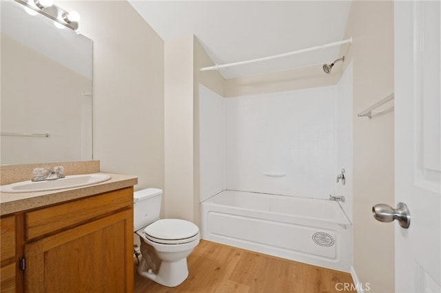 full bathroom featuring hardwood / wood-style floors, toilet, vanity, and bathing tub / shower combination