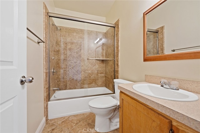 full bathroom featuring tile patterned floors, enclosed tub / shower combo, vanity, and toilet