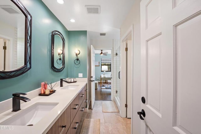 bathroom with tile patterned floors, ceiling fan, an enclosed shower, and vanity