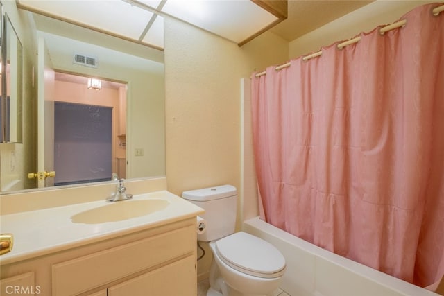 full bathroom with vanity, toilet, and shower / tub combo with curtain