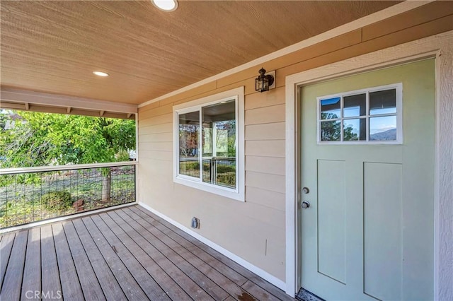 wooden terrace featuring covered porch