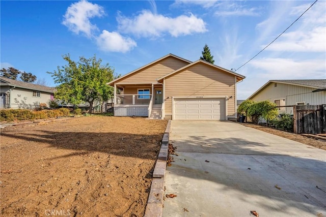 view of front of house with a garage and a porch