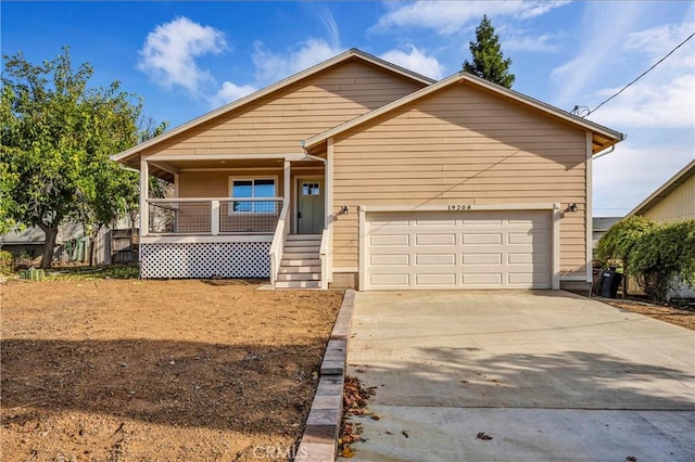 view of front of property with a porch and a garage