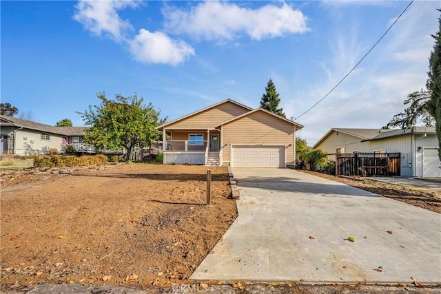 view of front of home with covered porch and a garage