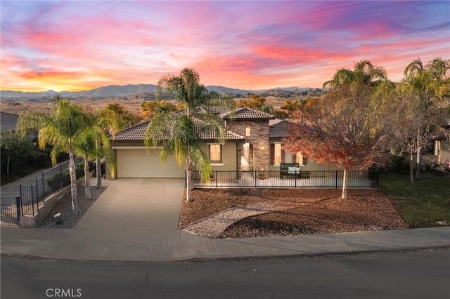 view of front of home featuring a mountain view and a garage