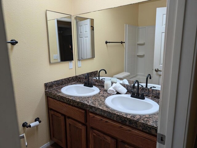 bathroom with vanity and bathtub / shower combination