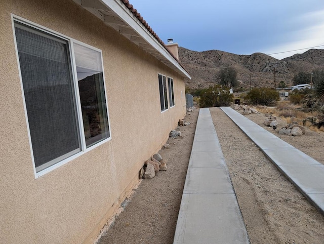 view of side of property featuring a mountain view