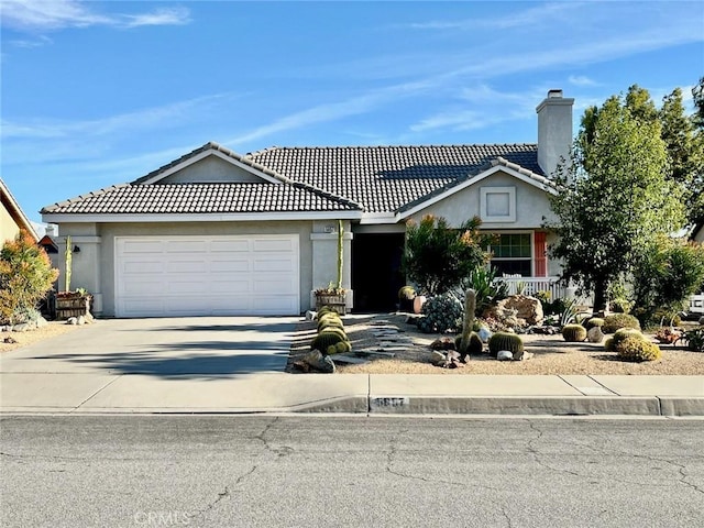 ranch-style house featuring a garage