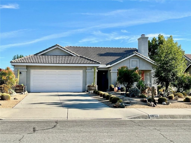 single story home with a garage