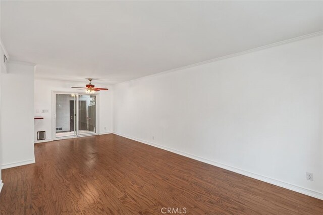 spare room with ceiling fan, hardwood / wood-style floors, and ornamental molding