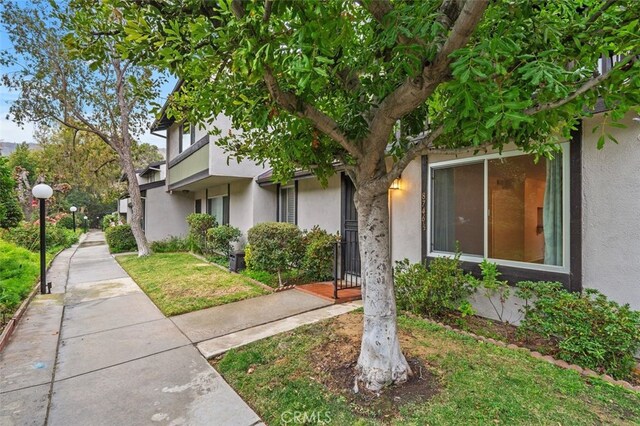 view of home's exterior with a yard