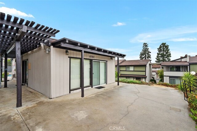 exterior space with a pergola and a patio area