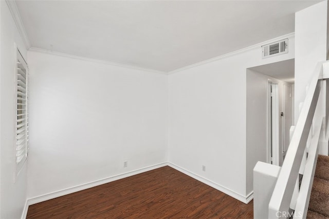 unfurnished room featuring hardwood / wood-style floors and ornamental molding