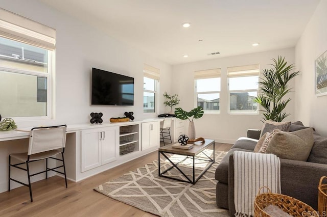 living room with light hardwood / wood-style flooring