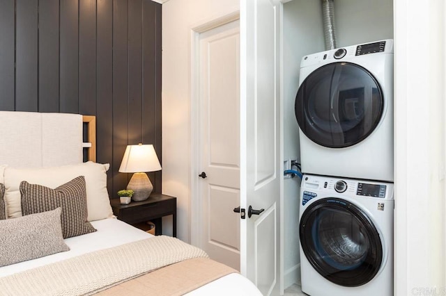 interior space featuring stacked washing maching and dryer