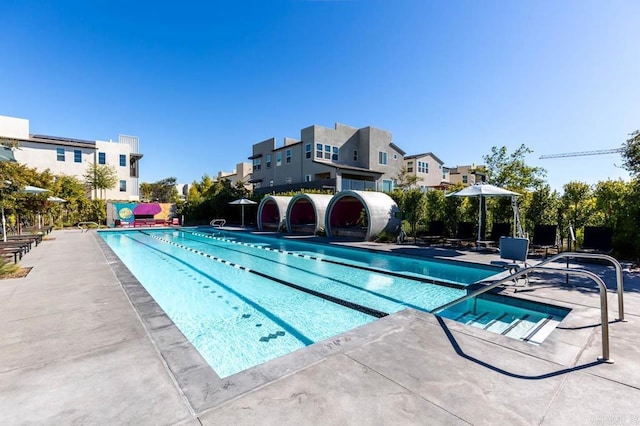 view of swimming pool featuring a patio area