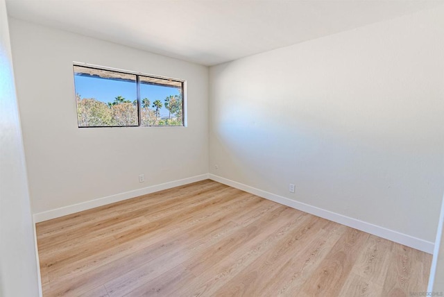 spare room with light wood-type flooring