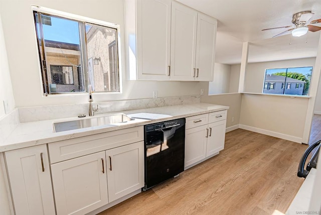 kitchen with dishwasher, white cabinetry, and sink