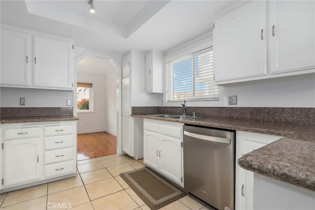 kitchen featuring dishwasher, white cabinetry, and a healthy amount of sunlight