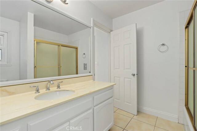 bathroom with tile patterned flooring and vanity