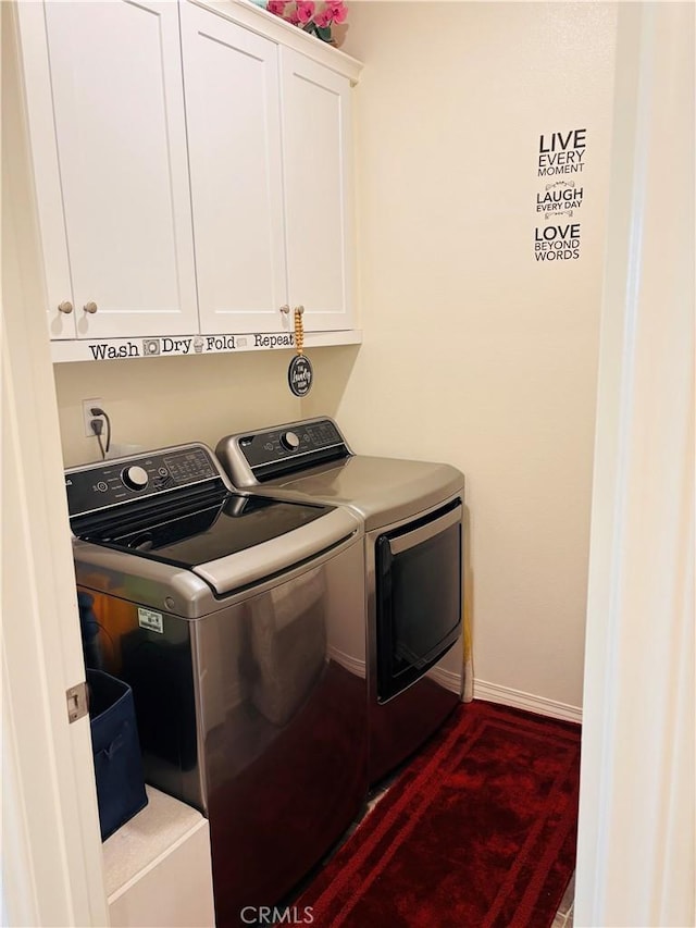 laundry room featuring dark hardwood / wood-style flooring, cabinets, and independent washer and dryer