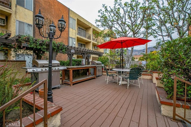 wooden deck featuring grilling area