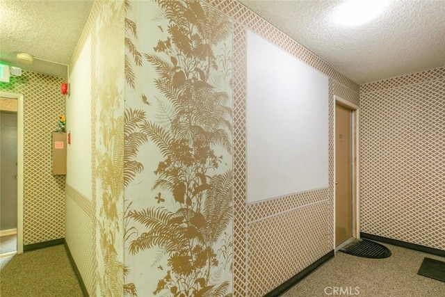 hallway featuring a textured ceiling